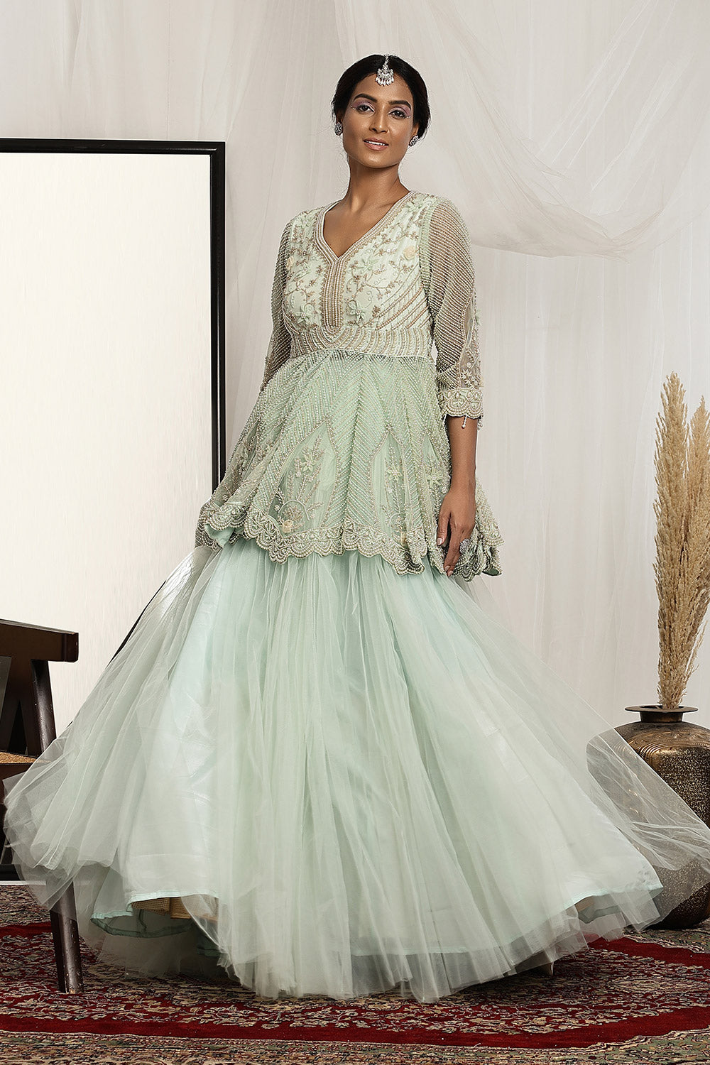 Embellished Peplum Top with a Ball Gown Skirt